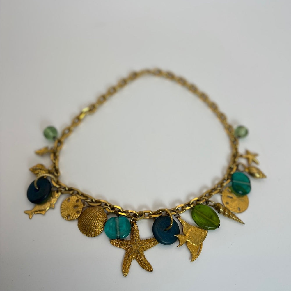 Gold tone nautical charm necklace