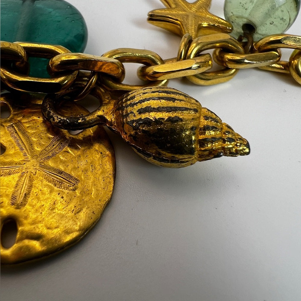 Gold tone nautical charm necklace
