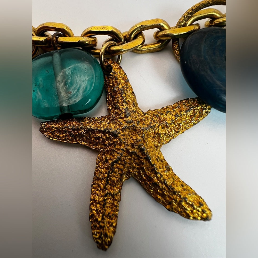 Gold tone nautical charm necklace