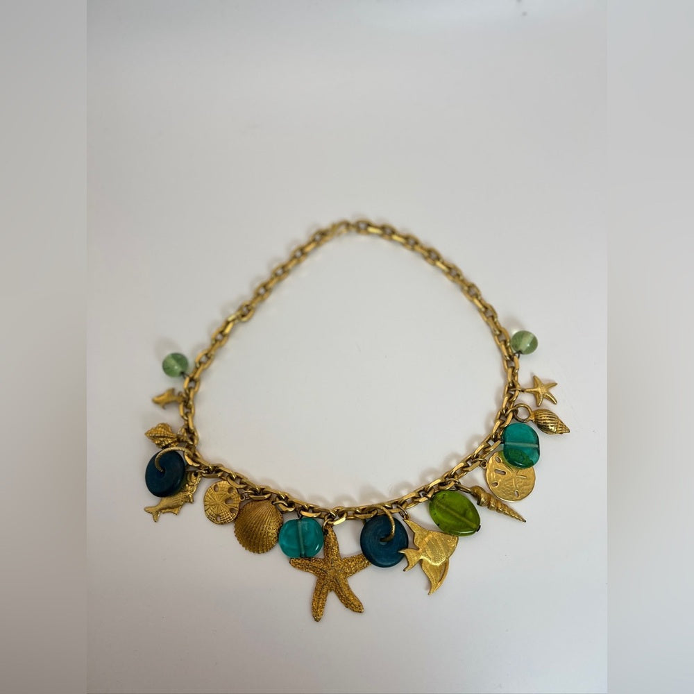 Gold tone nautical charm necklace