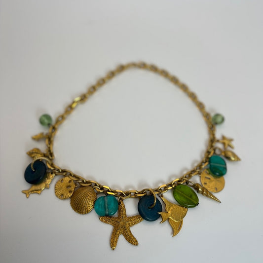 Gold tone nautical charm necklace