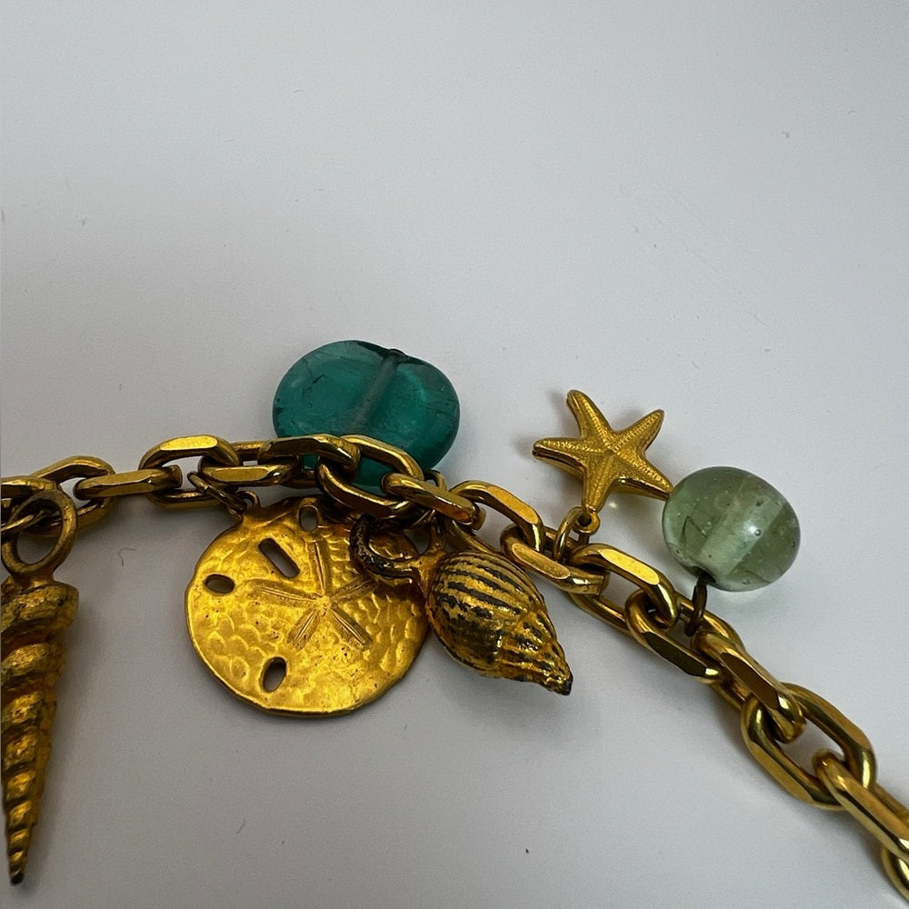 Gold tone nautical charm necklace