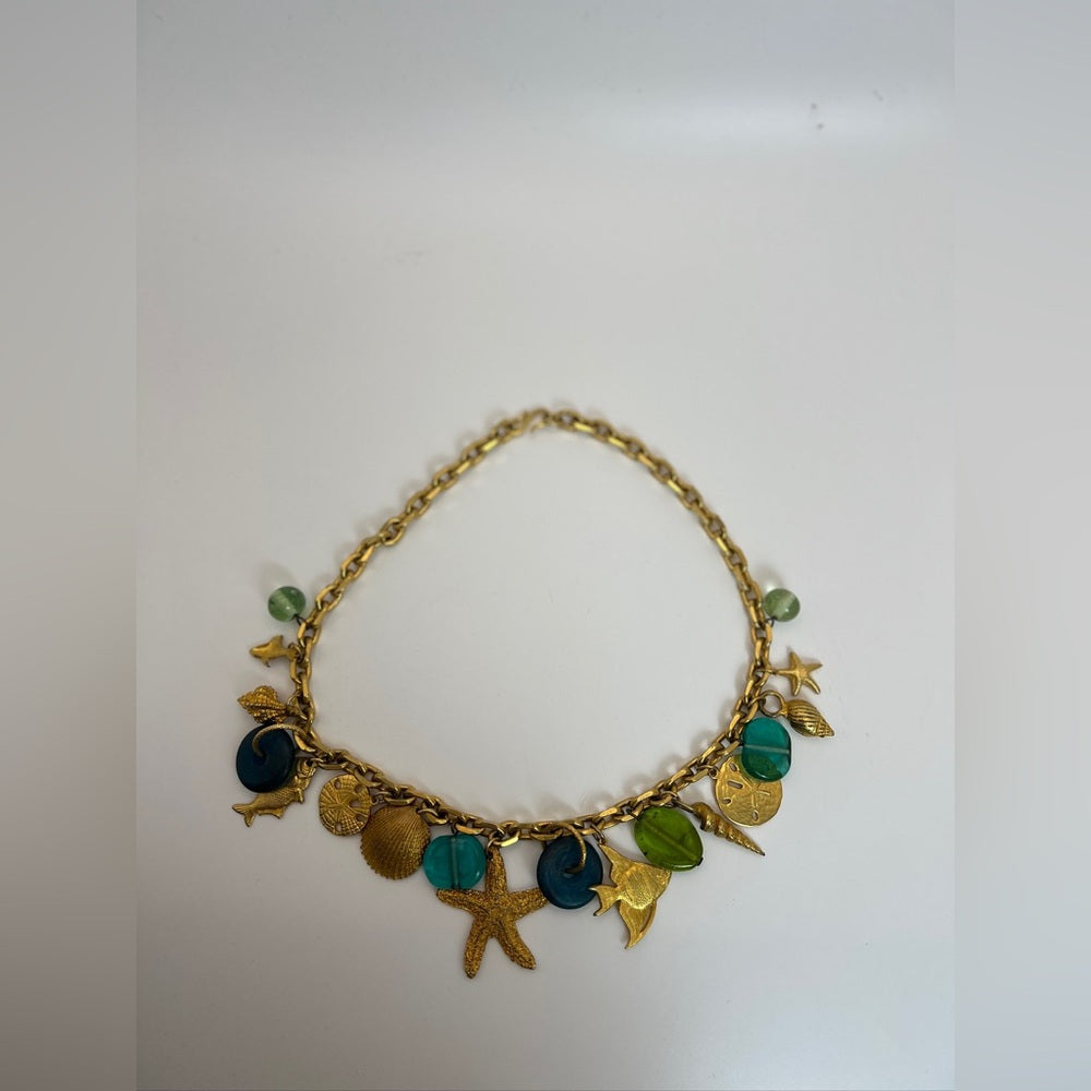 Gold tone nautical charm necklace