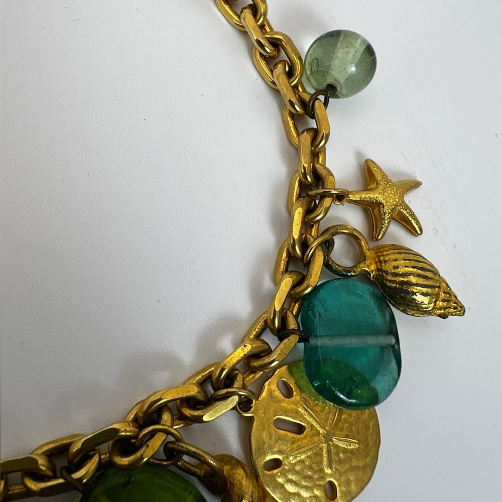 Gold tone nautical charm necklace