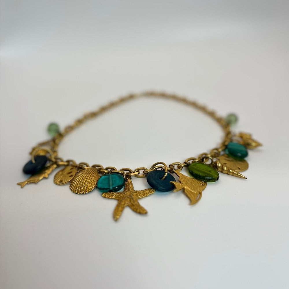 Gold tone nautical charm necklace